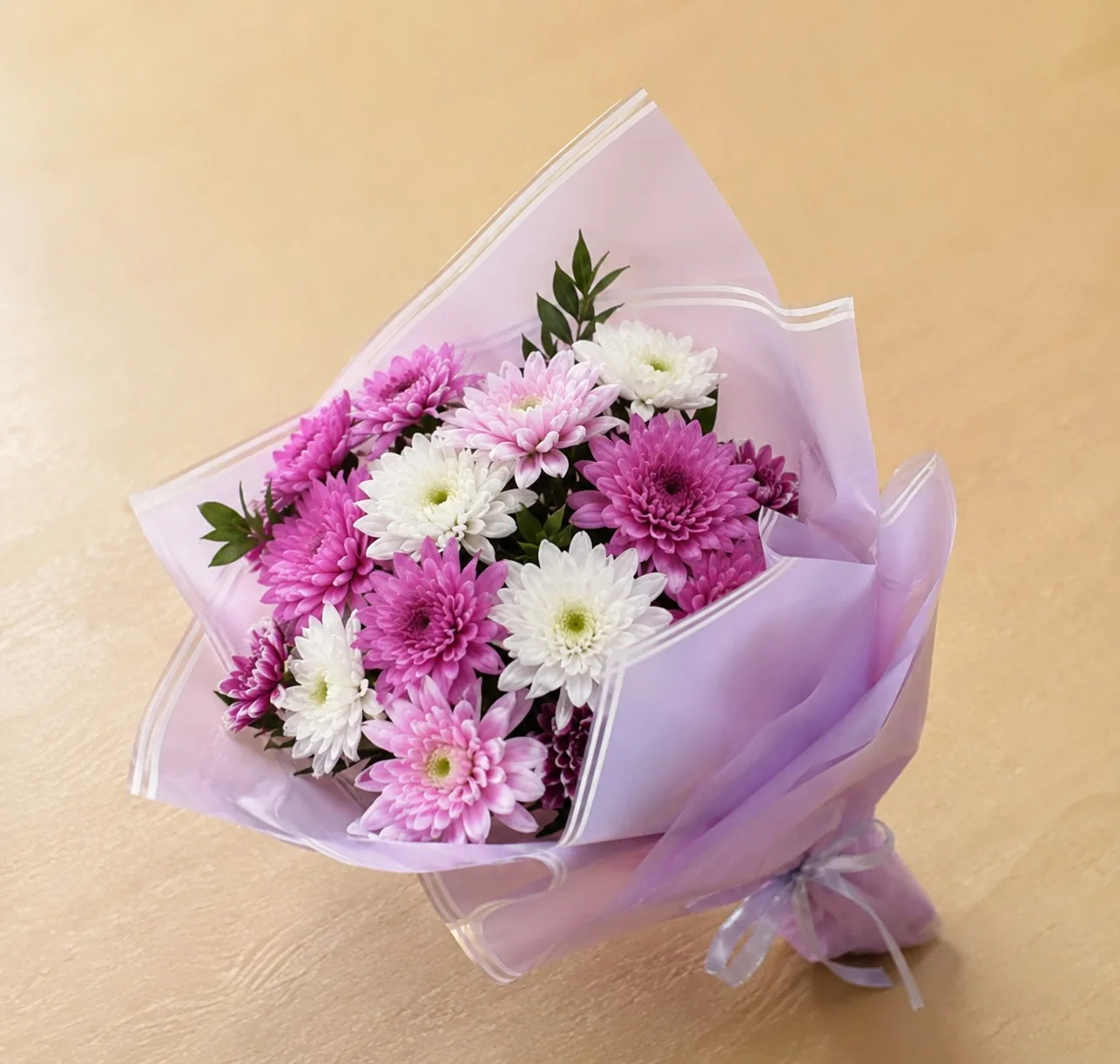 Pink and white chrysanthemum posy in lilac wrap