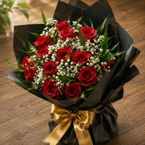 Two dozen red roses with gypsophila in black marbled wrap