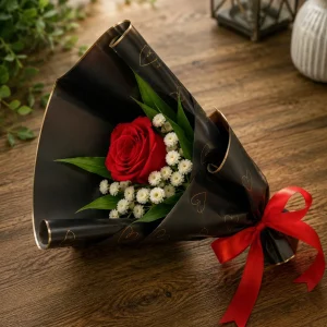 Single red rose with white chrysanthemums in black wrap